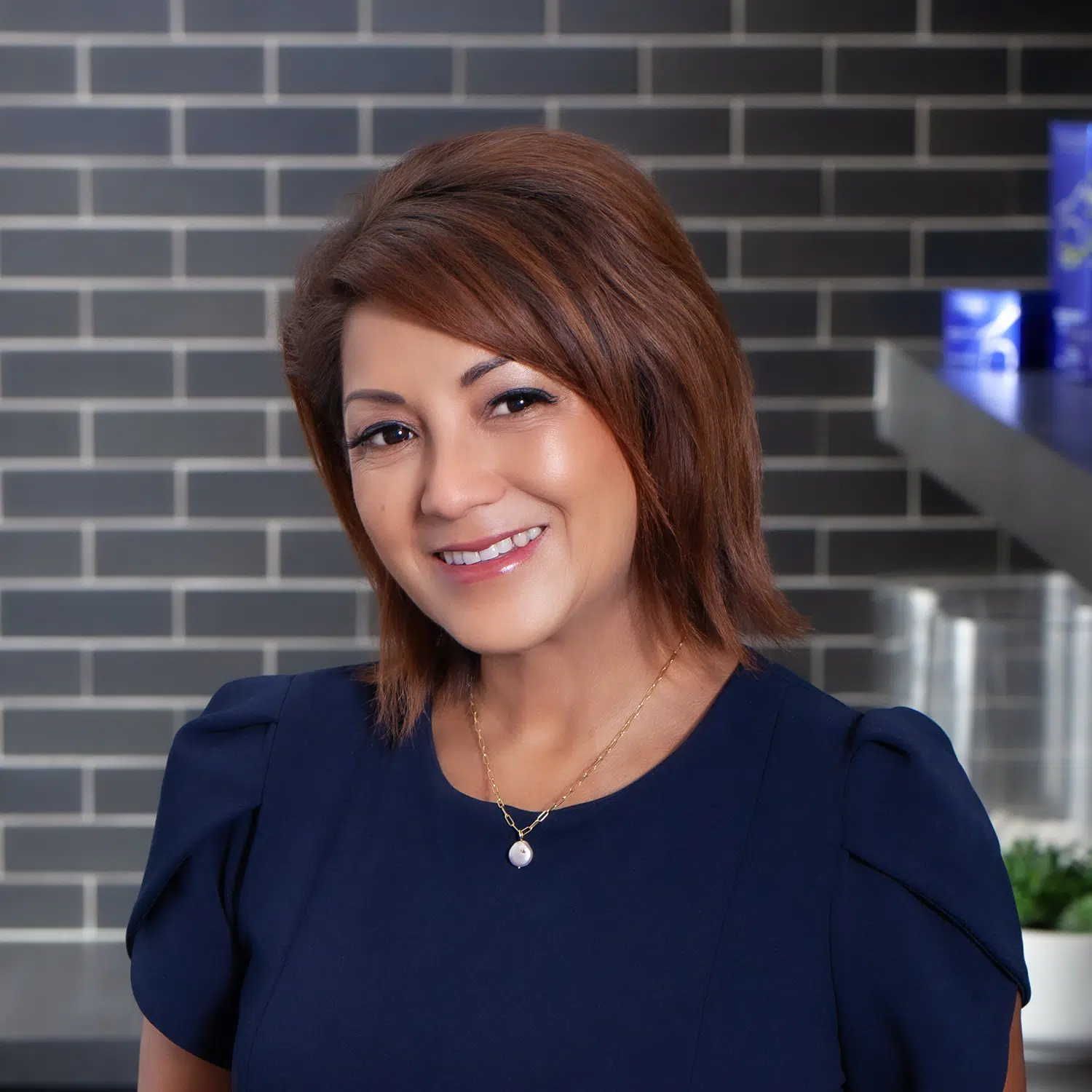 Professional headshot of Norelly Palomares, RN, Advanced Aesthetic Nurse at Advanced Institute for Plastic Surgery serving Temecula and Redlands, CA.